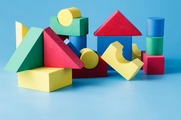 The toy castle from color blocks on  blue background — Stock Photo, Image