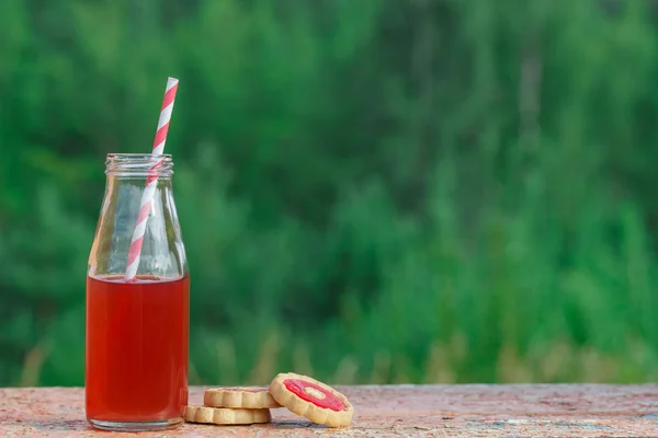 Closeup of a red detox drink with a red drinking straw — Stock Photo, Image