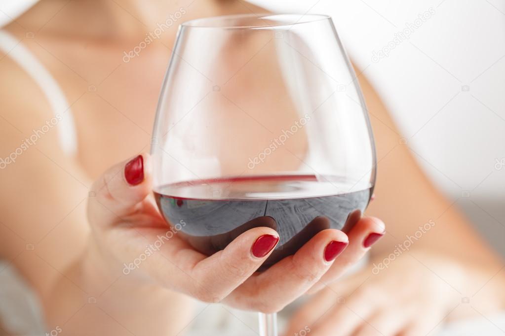 Woman drinking red wine