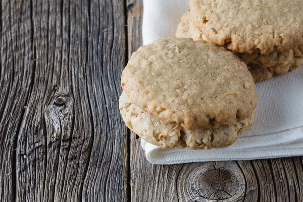 Oat cookies on rustic wooden table — Stock Photo, Image