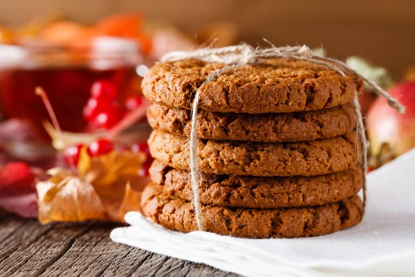 Fall harvesting on rustic wooden table with oat cookies — Stock Photo, Image