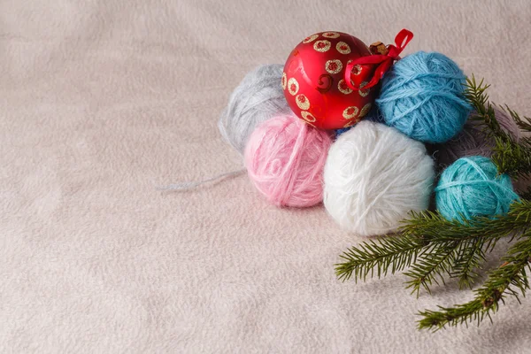 Heap of wool clew on soft background with christmas decoration