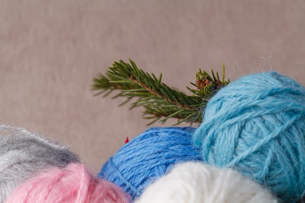 Heap of wool clew on soft background with christmas decoration