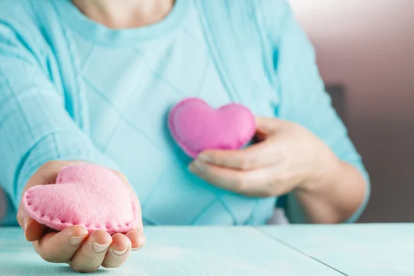 Love concept. Female holding a hearts in hands. — Stock Photo, Image