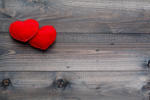 Aged wooden background with red heart