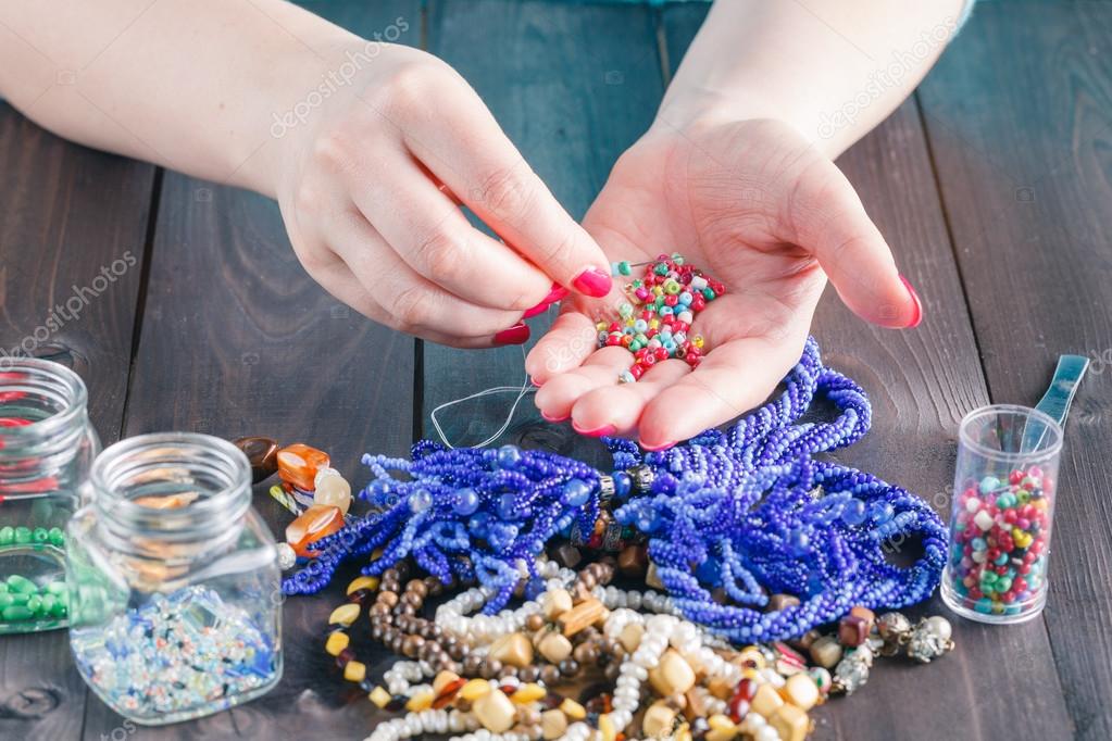 Stringing beads on the needle — Stock Photo © AndreyCherkasov