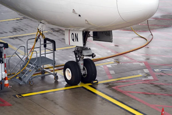 Close-up of Swiss airplane front wheels at Zurich airport. Photo taken May 1st, 2021, Kloten, Switzerland.