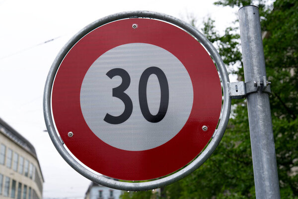 Close-up of traffic sign speed limit 39 kilometer per hour at City of Zurich on a rainy summer day. Photo taken July 16th, 2021, Zurich, Switzerland.