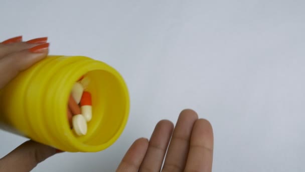 Closeup Shot Woman Pouring Pills Out Yellow Bottle Her Hand — Stock Video