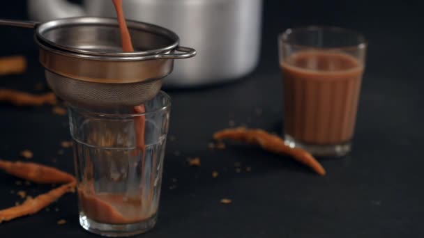 Hands Holding Sieve Strain Tea Pouring Transparent Glass Indian Chai — Stock Video