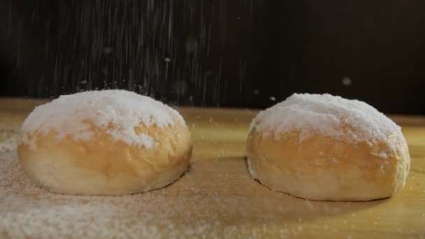 Powdered Sugar Being Sprinkled Dropping Freshly Baked Slices Bun Two — Stock Video