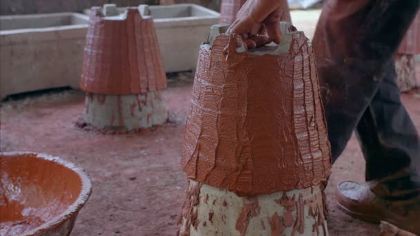 Shot Potter Applying Red Clay Cemented Planter Gamla — Stock Video