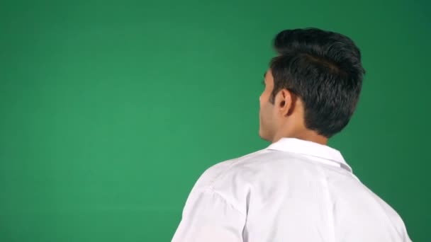 Young Doctor White Uniform Green Chroma Screen Looking Back Cheerful — Stock Video