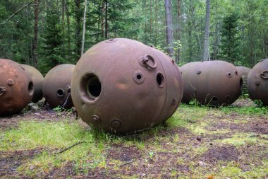Old soviet underwater naval mines casings scattered in the forest of Naissaar island, Estonia. Sea mines left behind by the Soviet army clipart
