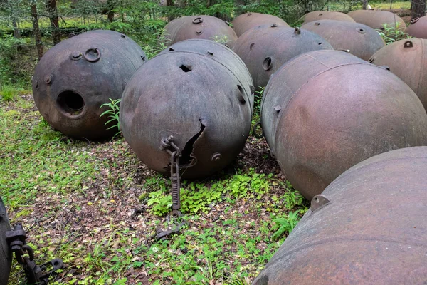 Old soviet underwater naval mines casings scattered in the forest of Naissaar island, Estonia. Sea mines left behind by the Soviet army