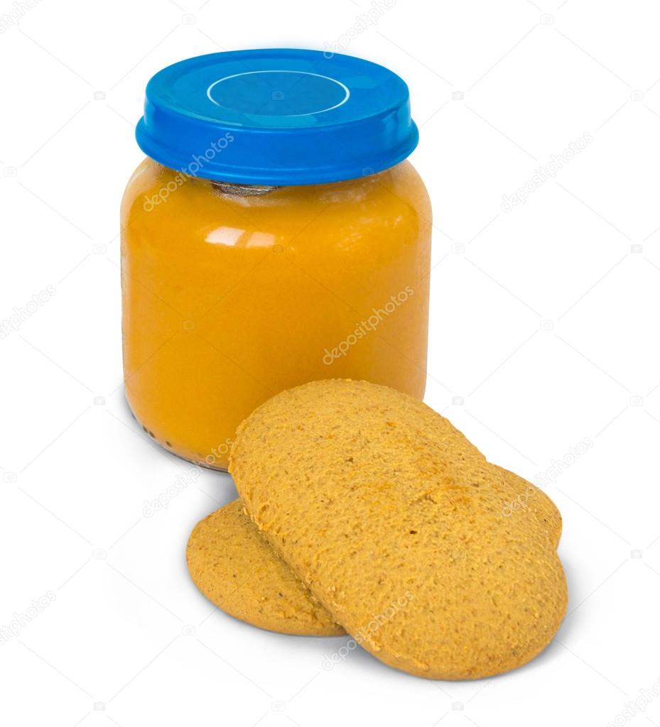 Baby food in glass jar and cookies, isolated on white