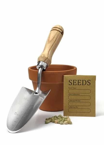 Seed bag with garden trowel and a terracotta pot — Stock Photo, Image