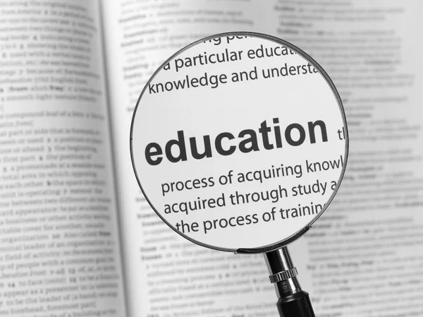 Lens and the inscription  Education — Stock Photo, Image