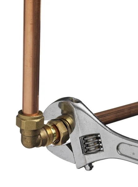 Copper pipe and wrench — Stock Photo, Image