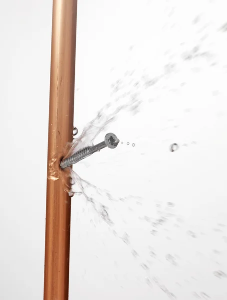 Leaking copper pipe on white — Stock Photo, Image