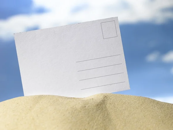 Blank Postcard in sand — Stock Photo, Image