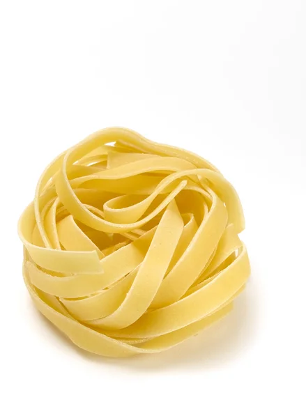 Isolated tagliatelle nest — Stock Photo, Image