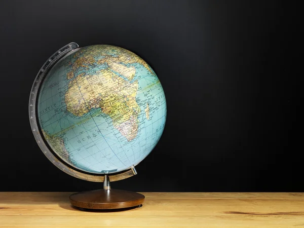 globe on a wooden table