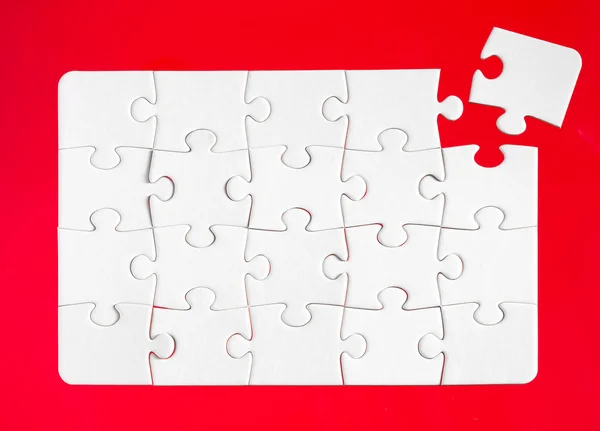 Jigsaw pieces with a red — Stock Photo, Image