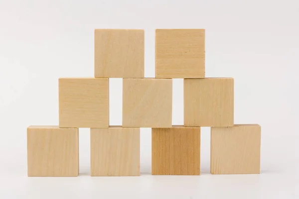wooden children\'s designer, constructor blocks, building sets piramid on white bachground, isolated