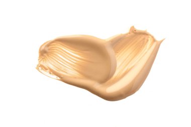 Sıvı bazlı boya darbeleri beyaza izole edilmiş. Kozmetik makyaj vakfı beyaz arka planda izole edilmiş, ton kremi lekeli, kapatıcı. Smar vuruşu.