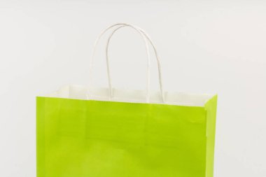 Bright light green gift bag, isolated on white background