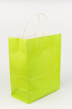 Bright light green gift bag, isolated on white background