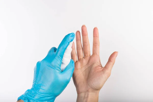 Hand One Person Blue Nitrile Glove Sprays Disinfectant Hands Another — Stock Photo, Image
