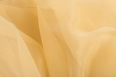 Mavi üzerine sarı renkli tül kumaş dokusu. Güzel yakın plan ve zarif detay kumaş arkaplanı. Yumuşak malzemeli lüks tül tekstil deseni.