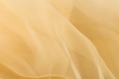 Mavi üzerine sarı renkli tül kumaş dokusu. Güzel yakın plan ve zarif detay kumaş arkaplanı. Yumuşak malzemeli lüks tül tekstil deseni.