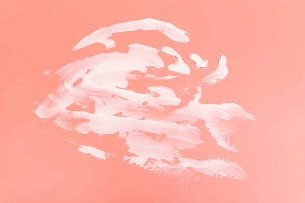 Weiße Schönheit Creme Lotion Textmarker Schmierfleck Auf Rosa Pfirsich Hintergrund — Stockfoto