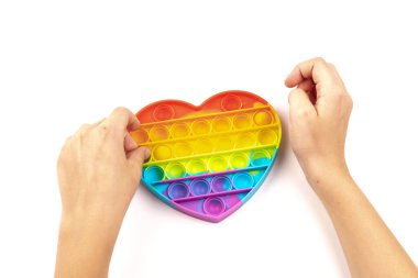 Silikon renkli anti-stres oyuncağı. Patlayan baloncuğa bas. Basit gamzeli oyuncak, kapat..