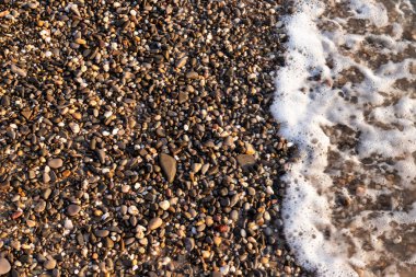 küçük çakıl kaya arka plan doku sahilde