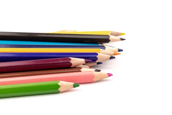白い背景に隔離された複数の色の鉛筆のスタック ストック写真