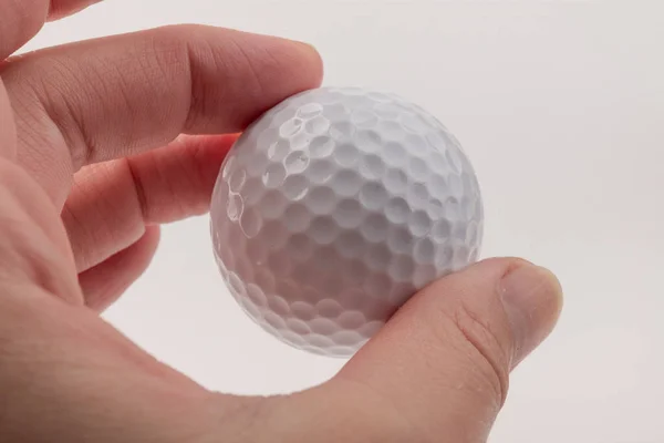 Cerca Mano Sosteniendo Pelota Golf Sobre Fondo Blanco — Foto de Stock