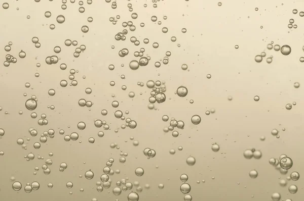 Gouden fizz bubbels — Stockfoto