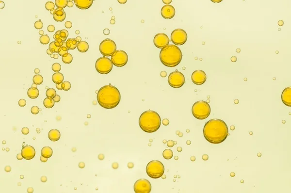 Yellow oil bubbles — Stock Photo, Image