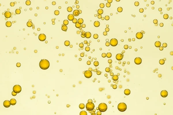 Golden fizz bubbles — Stock Photo, Image