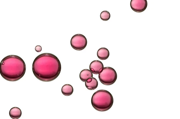 Красные пузыри воздуха над белым — стоковое фото