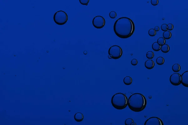 A group of dark blue bubbles. Flow, deep
