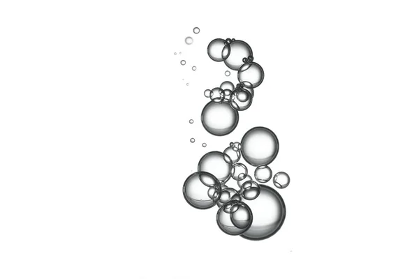 一群清澈的水泡流过白色的表面 Fizz — 图库照片