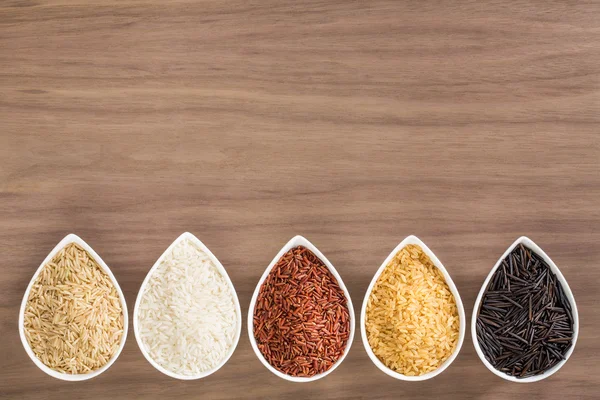 A colorful variety of rice in bowls — Stock Photo, Image