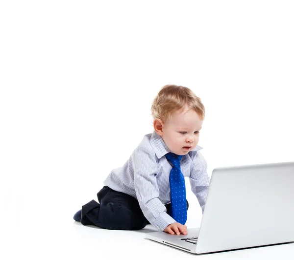 Baby boy with laptop Royalty Free Stock Photos
