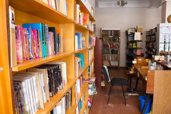 shelves with books  and the librarians desk