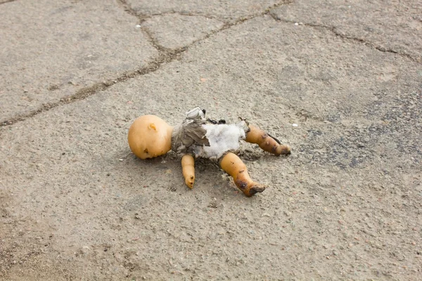 Burned old kewpie doll — Stock Photo, Image